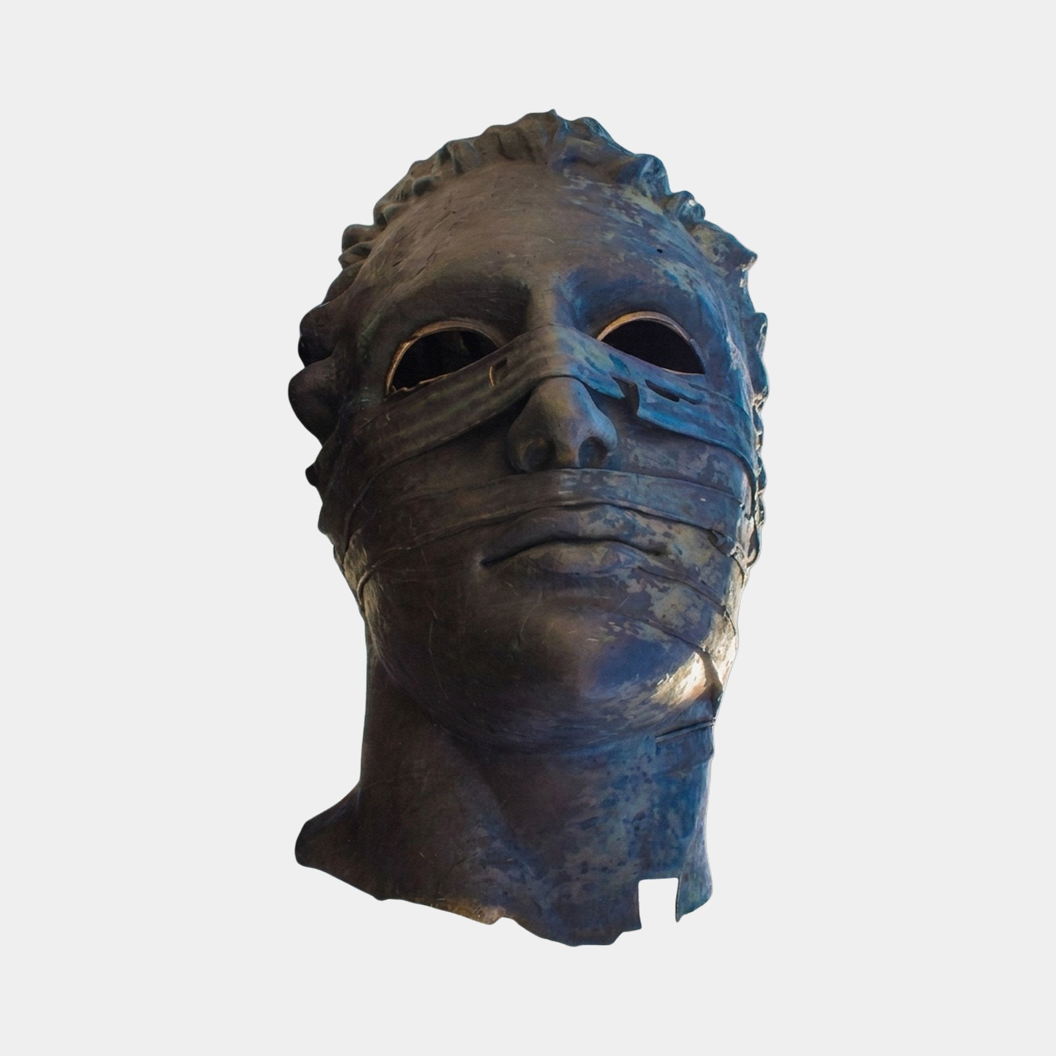 Monumental Contemporary Fragmented Head Bronze Sculpture by Giant Sculptures, front view with hollow eyes and banded face in dark bronze with blue patina.