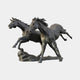 Monumental Contemporary Galloping Horses Bronze Fountain by Giant Sculptures, two dark-patinated horses charging side by side from a stone base, plain background.