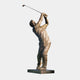 Monumental Contemporary Golfer Bronze Sculpture by Giant Sculptures, 310cm figure mid follow-through with club raised, warm bronze patina, on a dark plinth.