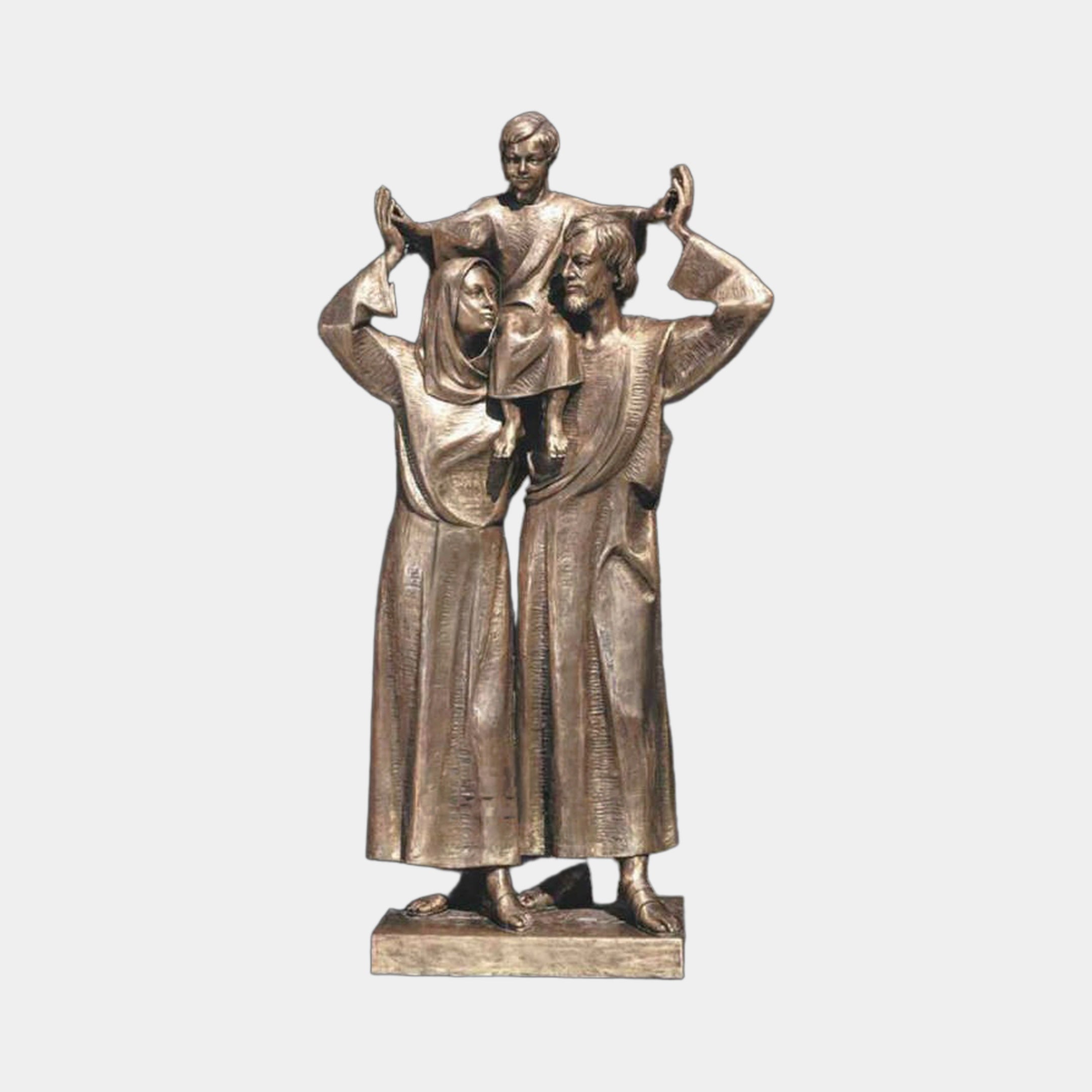 Giant Sculptures' Monumental Contemporary Holy Family Bronze Sculpture 300cm, showing a veiled woman and bearded man with arms raised holding a child aloft, warm golden-brown patina on a low plinth against a plain grey background.