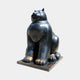 Monumental Contemporary Rotund Seated Cat Bronze Sculpture by Giant Sculptures in glossy black with golden-brown wear on the paws, shown front-angled on a plain background.