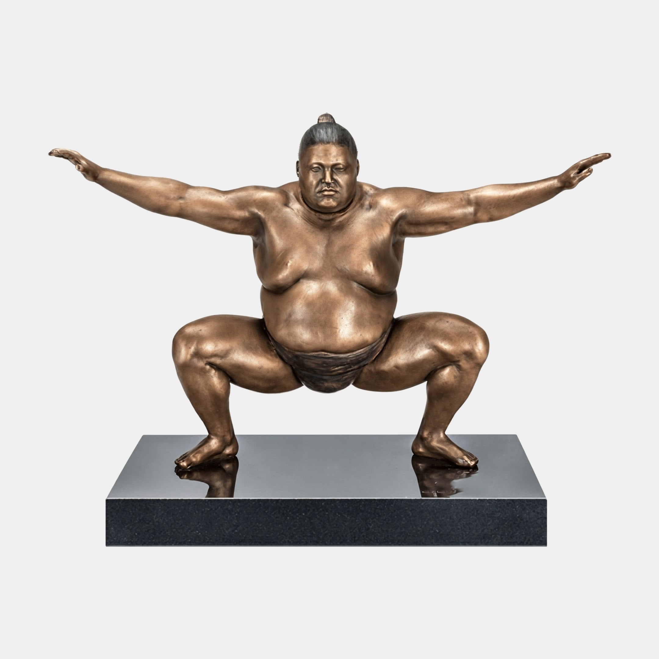 Monumental Contemporary Sumo Wrestler Bronze Sculpture by Giant Sculptures in shiko stance with arms extended, mid-brown patina, on a polished black granite base.