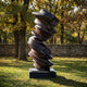 Monumental Contemporary Twisting Tornado Bronze Sculpture by Giant Sculptures, 260cm spiraling lobed form with dark patina on a granite plinth in a sunlit park.
