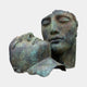 Giant Sculptures Monumental Contemporary Two Faces Bronze Sculpture with green verdigris patina, one upright closed-eyed face and a reclining face resting against it.