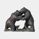 Monumental Fighting Bears Bronze Sculpture by Giant Sculptures, two bears rearing on hind legs with claws raised on a rocky base, dark patina, plain background.