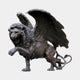 Monumental Heraldic Winged Lion Bronze Sculpture by Giant Sculptures, rearing and roaring with wings swept wide and serpentine tail curling, dark antique patina.