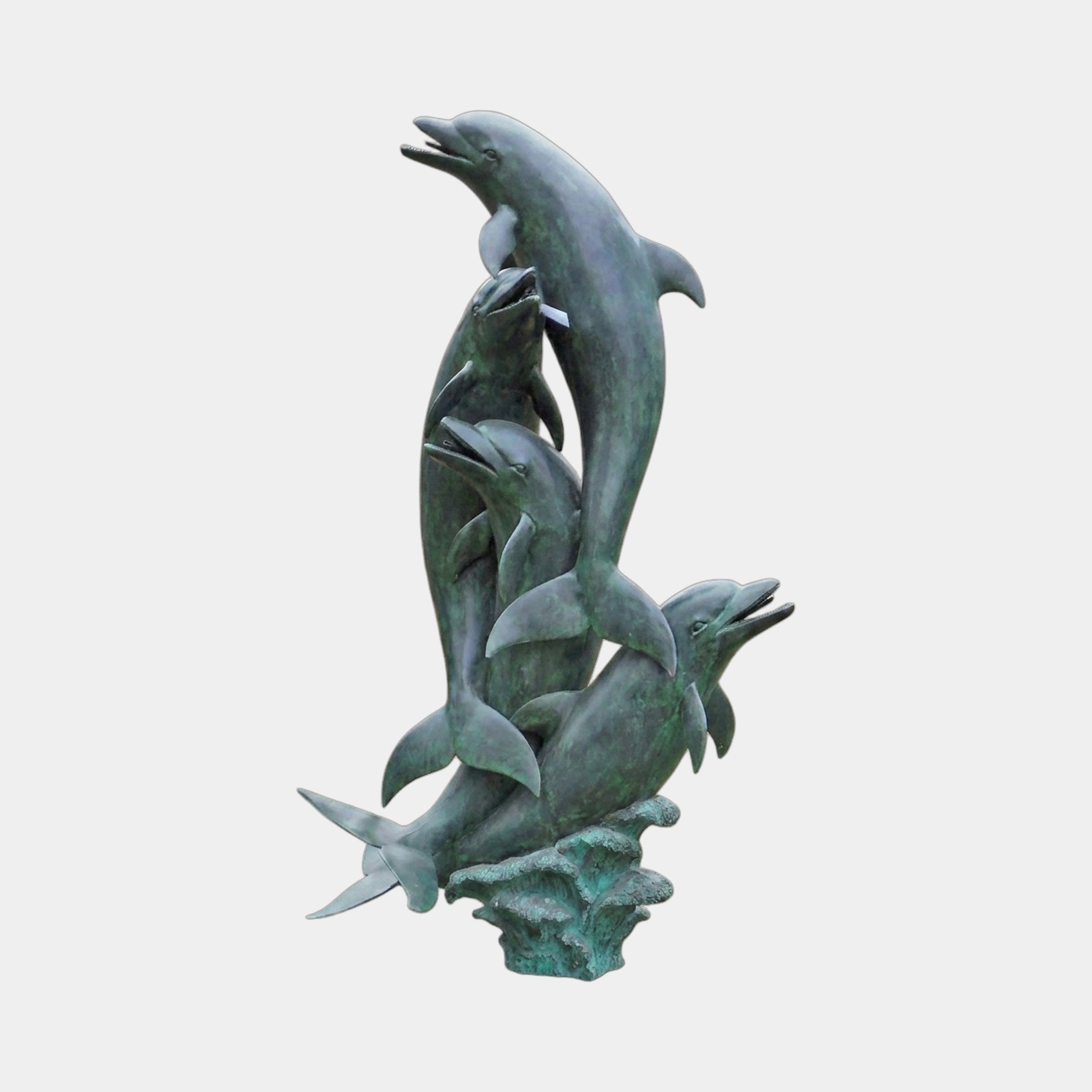 Monumental Leaping Dolphins Bronze Fountain by Giant Sculptures, five dolphins spiralling upward from a wave-form base in verdigris patina, shown against a plain background.