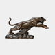 Monumental Life-Size Leaping Tiger Bronze Sculpture by Giant Sculptures, shown mid-lunge with bared fangs and extended claws on a rocky base, plain background.