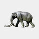 Monumental Life-Size Walking Elephant Bronze Sculpture by Giant Sculptures, side view with long sweeping tusks and dark patina, shown on a plain background.