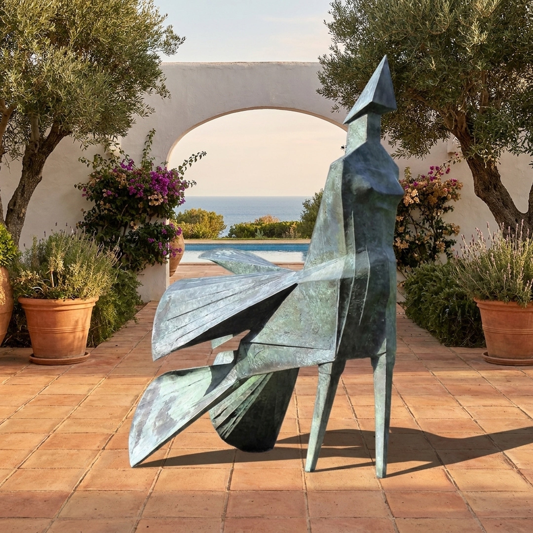 Monumental Modern Abstract Geometric Figure Bronze Sculpture by Giant Sculptures with verdigris patina, displayed on a terracotta patio with olive trees and sea view.