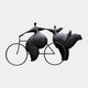 Monumental Modern Rotund Figures on Bicycle Bronze Sculpture by Giant Sculptures, 240cm, two rounded black-patina figures on a slender bronze bicycle frame.