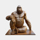 Monumental Seated Gorilla Bronze Sculpture 250cm by Giant Sculptures, cross-legged pose with warm golden-brown patina on a matching rectangular plinth.