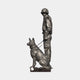 Giant Sculptures' Monumental Soldier and German Shepherd Bronze Sculpture in near-black patina, soldier in helmet standing beside a seated leashed dog.