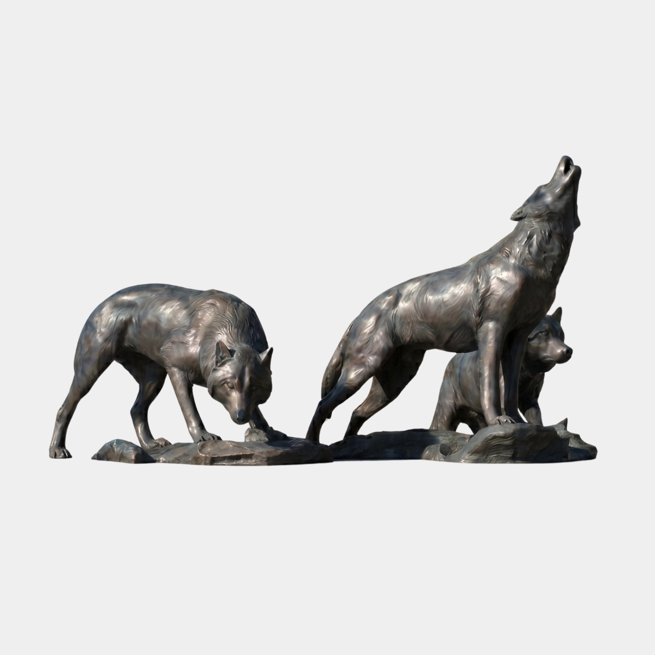 Giant Sculptures Monumental Three Wolf Bronze Sculpture 220cm with a stalking wolf, a howling wolf, and a crouching wolf on a rocky base, shown on plain background.