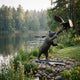 Monumental Traditional Bear and Eagle Bronze Sculpture 300cm by Giant Sculptures, dark patinated bear rearing toward a descending eagle, beside a forest lake.