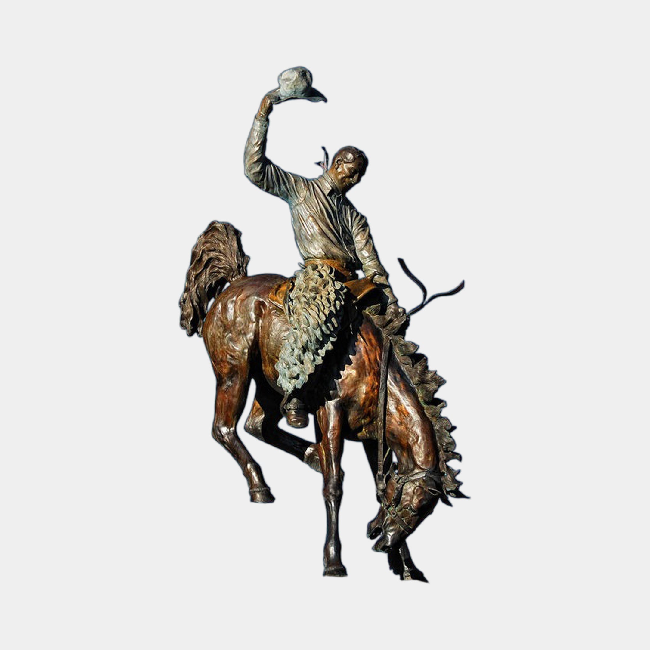 Monumental Traditional Cowboy on Bucking Bronco Bronze Sculpture by Giant Sculptures, rider raising hat atop a rearing horse, warm brown patina with green accents.