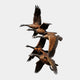 Monumental Traditional Flying Canada Geese Bronze Sculpture by Giant Sculptures, six geese in vertical ascending formation with outstretched wings, on a light background.