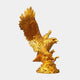Monumental Traditional Golden Eagle Bronze Sculpture by Giant Sculptures, polished gold finish, wings raised and beak open on a rocky base, plain background.