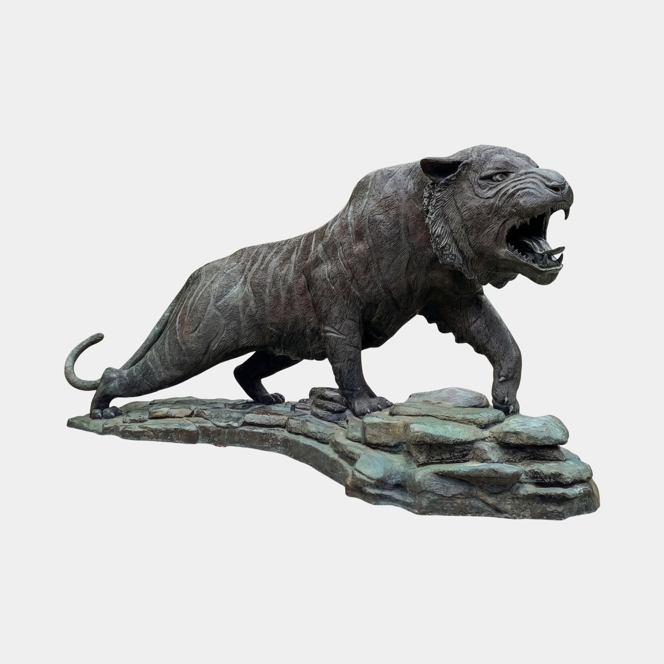 Monumental Traditional Roaring Tiger Bronze Sculpture 300cm by Giant Sculptures, shown in side profile mid-lunge on a verdigris rocky base, plain background.