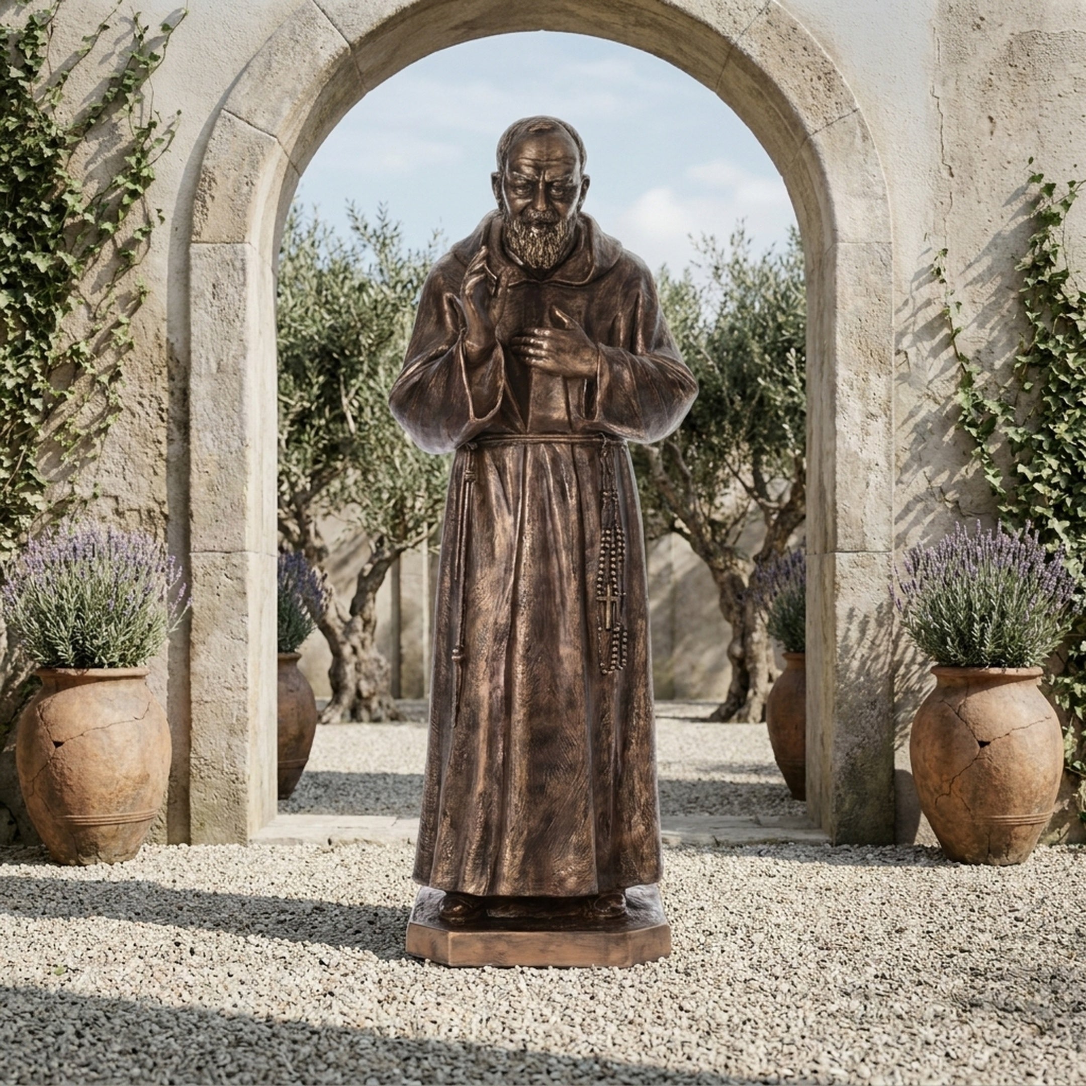Giant Sculptures Monumental Traditional Robed Friar Bronze Statue 300cm with raised hand and rosary, displayed on gravel beneath a stone archway in a garden.
