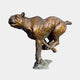 Monumental Traditional Running Cougar Bronze Sculpture by Giant Sculptures, shown mid-sprint in side profile with warm reddish-brown patina on a stone base.