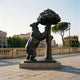 Giant Sculptures Monumental Standing Bear and Strawberry Tree bronze, 500cm, reared bear gripping a canopied tree, dark patina, displayed on a stone plaza.