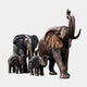 Monumental Trumpeting Elephant Herd Bronze Sculpture by Giant Sculptures, showing two adults with trunk raised and two calves in dark antique bronze patina.