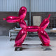 A vibrant pink dog sculpture placed in a contemporary industrial environment, perfect for adding a pop of color and modern art to urban interiors.