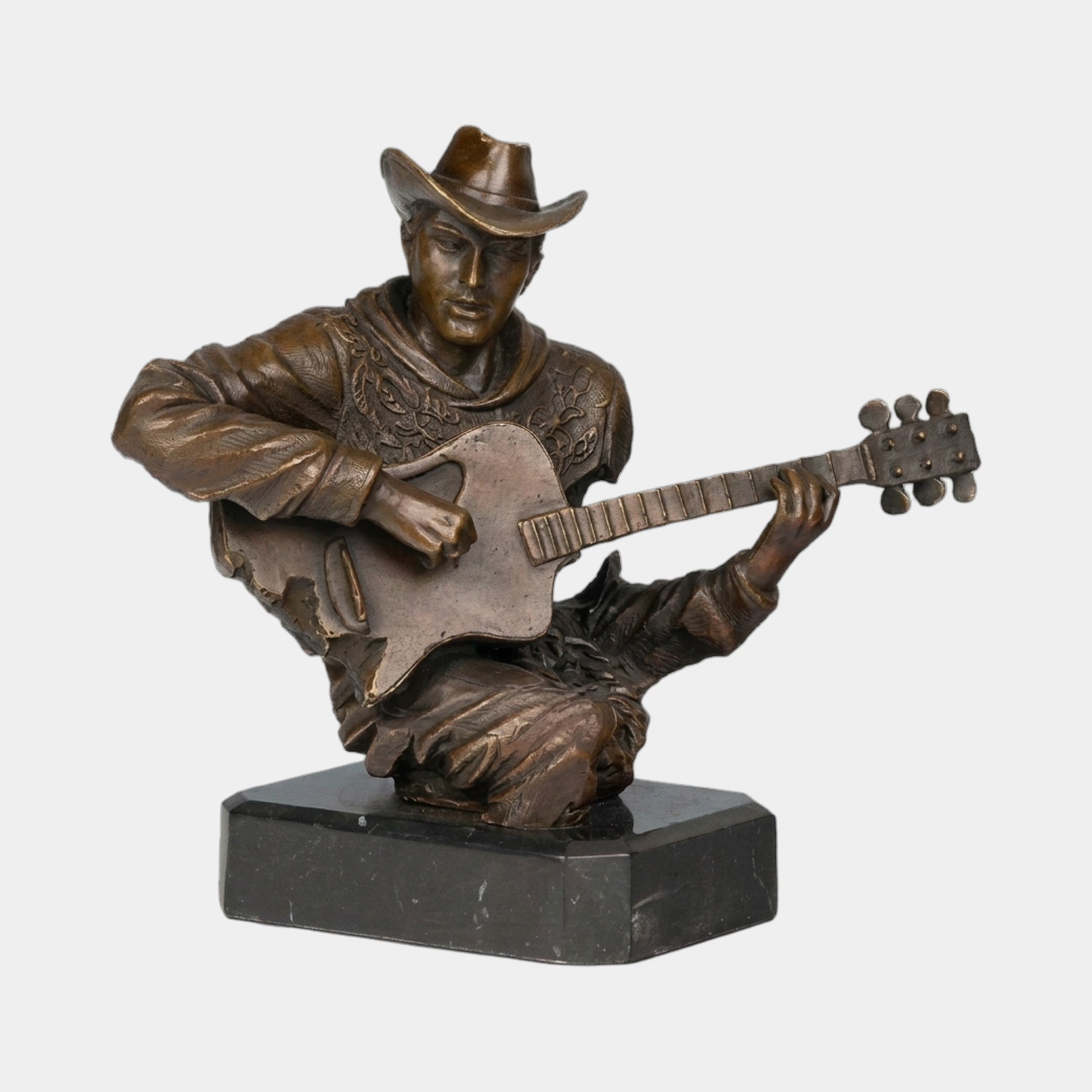 Traditional Cowboy Guitarist Bronze Bust by Giant Sculptures, a warm brown patinated figure in a cowboy hat strumming a guitar, set on a black marble base.