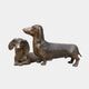 Traditional Dachshund Pair Bronze Sculpture by Giant Sculptures, 40cm, showing one standing dachshund with head raised and one lying beside it, antique brown patina, plain background.