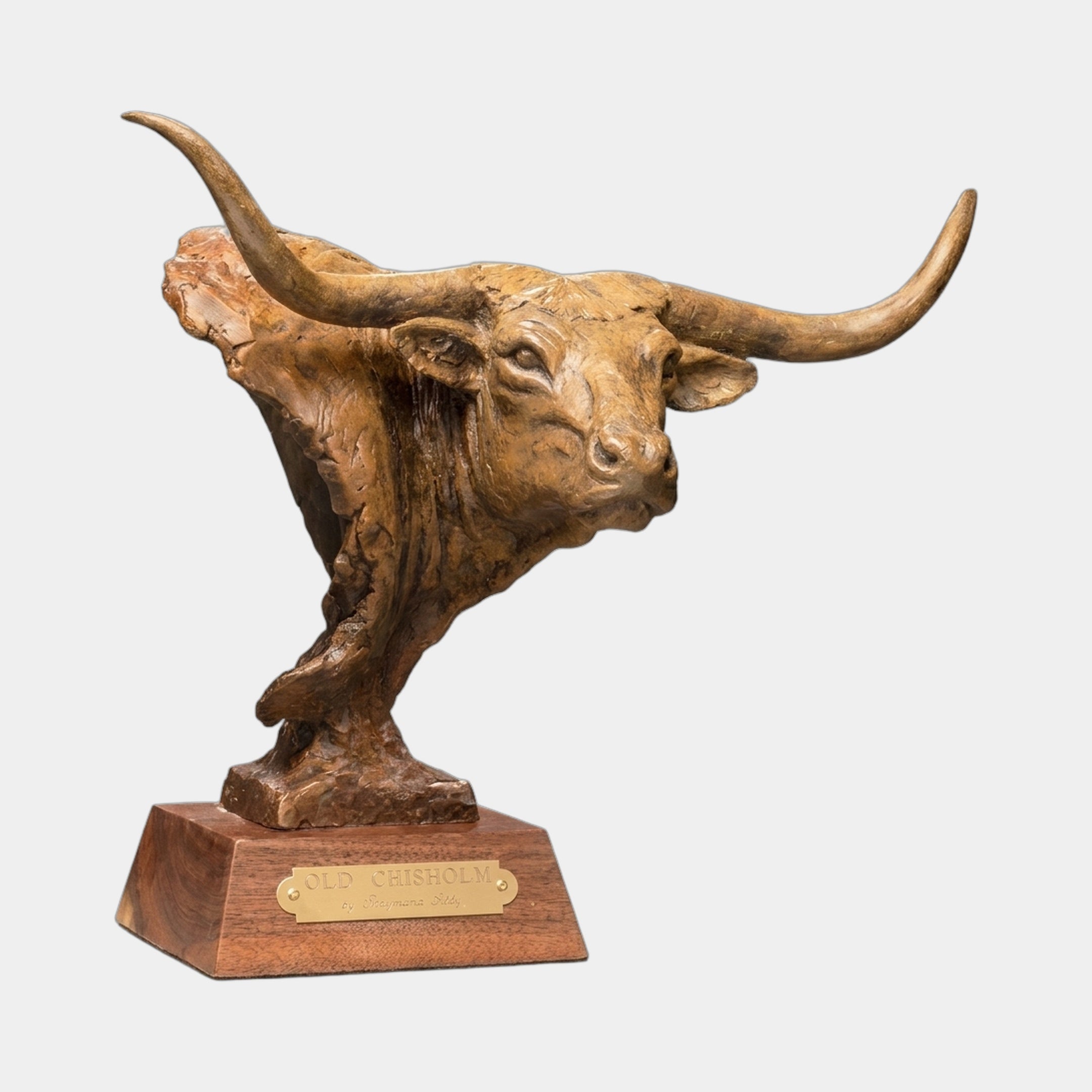 Traditional Longhorn Bull Head Bronze Bust by Giant Sculptures in warm golden-brown patina, mounted on a stepped hardwood plinth with an "Old Chisholm" brass nameplate.