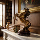 Traditional Rearing Horse Bronze Sculpture by Giant Sculptures on a round lacquered wood stand, displayed on a marble mantel with leather-bound books and a vase.